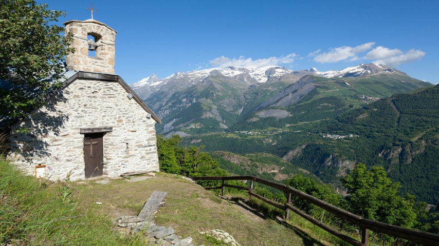 French Alps https://www.pexels.com/photo/view-of-a-small-chapel-green-valley-and-snowcapped-mountain-peaks-in-french-alps-16633496/