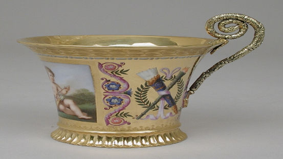 Sèvres cup with silver handle from a breakfast service: https://commons.wikimedia.org/wiki/File:Cup_(tasse_Jasmin),_part_of_Breakfast_Service_(d%C3%A9jeuner)_MET_LC-56_29_5-002.jpg#/media/File:Cup_(tasse_Jasmin),_part_of_Breakfast_Service_(d%C3%A9jeuner)_MET_LC-56_29_5-002.jpg